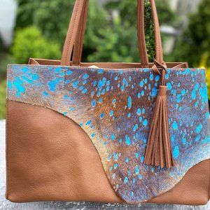 Raw edge brown and blue leather tote